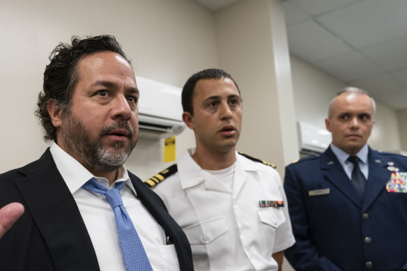 Lawyer Brian Bouffard, left, accompanied by US Navy Liuetenant Commander Aaron Shephard, and US Air Force Major Jason Cordova, after an arraignment hearing for their client, Malaysian defendant Mohammed Nazir bin Lep, in Guantanamo Bay Naval Base on Monday. 