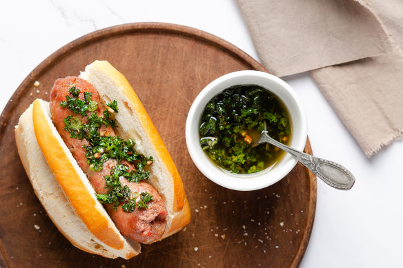 A choripan with chimichurri sauce.