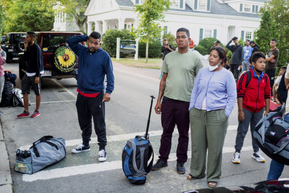 Migrants, who arrived on a flight sent by Florida Governor Ron DeSantis, gather with their belongings on Martha’s Vineyard. 
