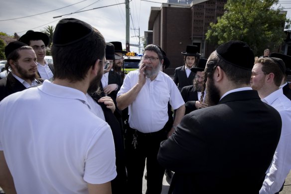 Yumi Friedman (centre) was inside the synagogue when the building was firebombed.