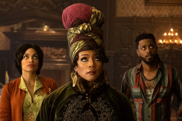 Rosario Dawson (left) as Gabbie, Tiffany Haddish as Harriet and LaKeith Stanfield as Ben in Haunted Mansion.