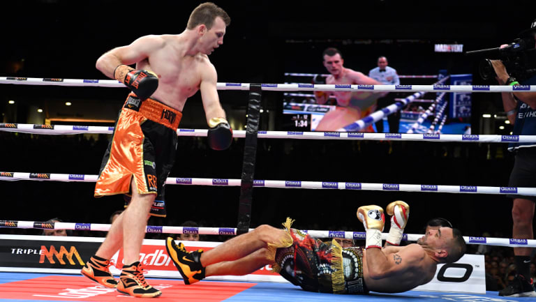 Next generation: Jeff Horn stands over Anthony Mundine as he hits the canvas.