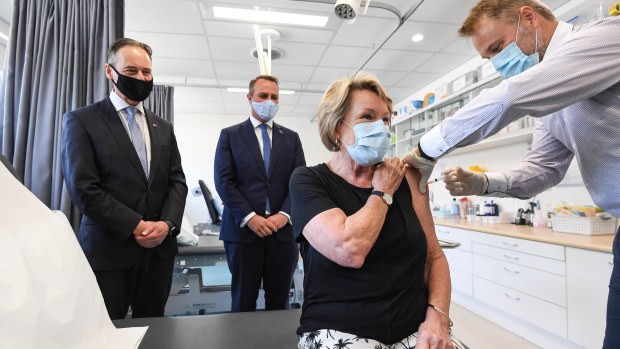 (left to right)  Health Minister Greg Hunt, Tim Watson , Dale Austin (patient) and Dr Nick Kokotis.
Health Minister Greg Hunt in Sandringham visiting the Bluff Road Medical Centre. 29th March 2021 The Age News Picture by JOE ARMAO