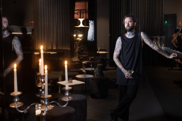 Purple Pit co-owner Joe Jones in the candlelit basement bar.