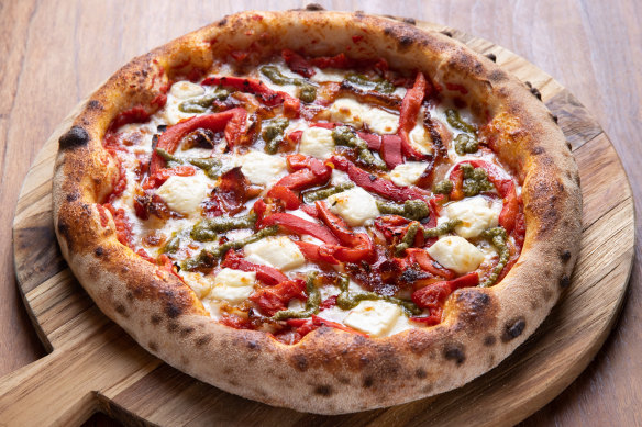 The Faz pizza topped with roasted peppers, pancetta, pesto, mozzarella and feta.