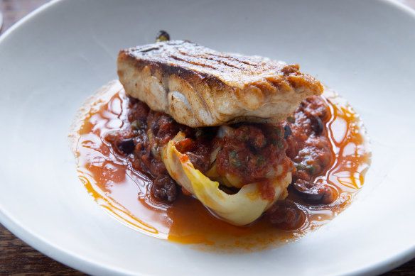 Crisp-skinned baby snapper with puttanesca sauce, buttery cabbage, and olives.