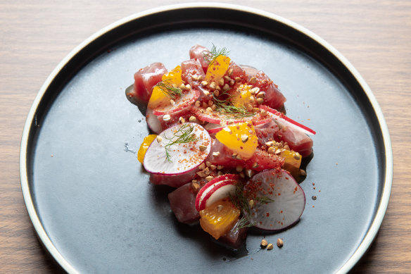 Tuna tartare is dressed with Aleppo chilli, tangelo and buckwheat.