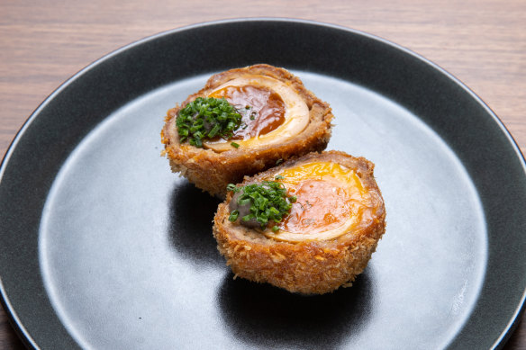 Ramen scotch eggs have soft-yolked eggs wrapped in pork mince, then crumbed and deep-fried.