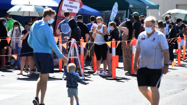 People queue to receive a COVID-19 vaccine at Bunnings in Brisbane in October.