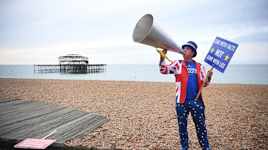 Pro-remain protester Steve Bray protests on a beach at Brighton, where the Labour conference is debating the party's stance on Brexit.