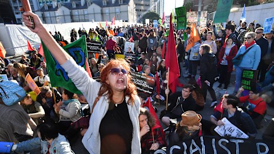 Extinction Rebellion protesters block Brisbane CBD streets.