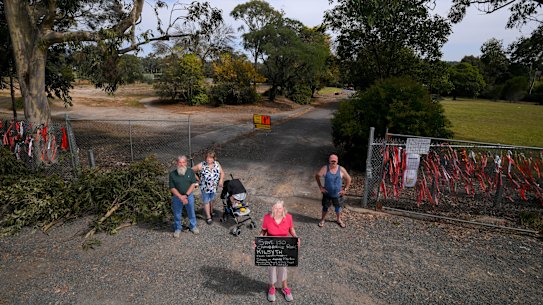 Kilsyth residents Shelly Large, John Phillips and wife Carol with George Stephens (right) at the empty land on Cambridge Road.
