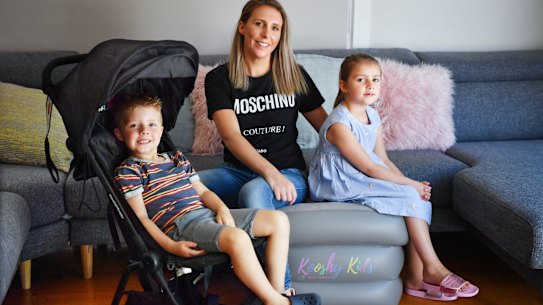 Louisa Williams with her childre Mila and Jack and some of the baby equipments she shares through sharing platform Kindershare.