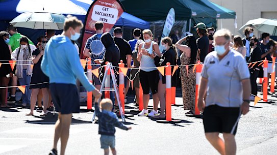 People queue to receive a COVID-19 vaccine at Bunnings in Brisbane.