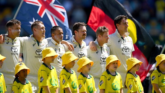 Australian players before the start of play in Brisbane.