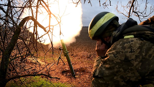 Soldiers with the Ukrainian army’s 68th Brigade fire a mortar at Russian positions in the Donetsk region.