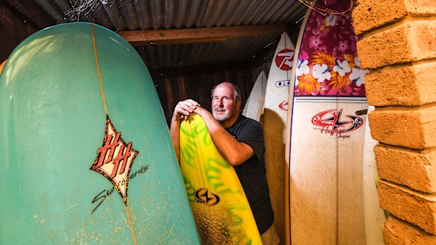 Howard Hughes with some of his surfboard collection.