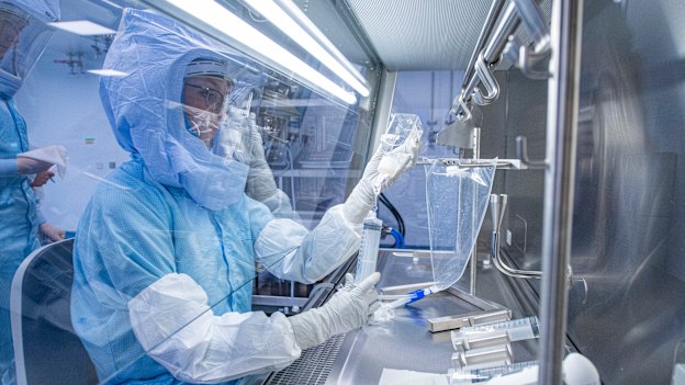 Technicians at a German lab of BioNTech, which partnered with Pfizer to produce a COVID-19 vaccine. “Whenever someone raised a complication,” Albert Bourla says, 
“I would respond, ‘People are dying. There is no excuse. Solve it.’ ” 