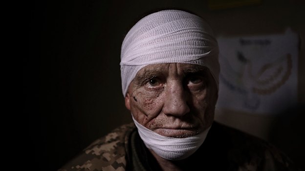 At a medical stabilisation point in Bakhmut, Ukrainian soldier Oleh Nazarov, 51, has sustained head, neck and back injuries from a grenade attack in his trench.