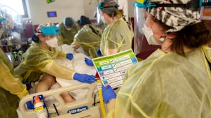 A COVID-19 patient receives treatment in Sunshine Hospital