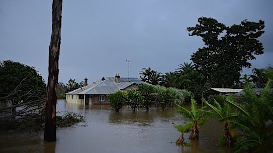 A private property inundated by water on the banks of the Wallamba River on The Lakes Way near Tuncurry.