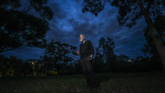 Dr Barry Clark measuring light levels in Royal Park.