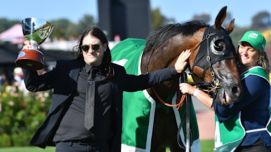 Matthew Gudinski with Homesman, which was owned by his father Michael Gudinski, after the Australian Cup victory on Saturday.