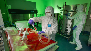 CSIRO has just completed a new vaccine manufacturing lab that they think is the ‘missing link’ in vaccine preparedness. Seen here Biomdecal scientists David Bloomen and Mylinh La (left).  