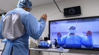 Artificial intelligence watches hospital workers put on PPE to check for COVID safety