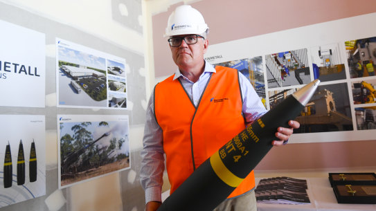 Lacking firepower? Australian Prime Minister Scott Morrison with a shell at an ammunition factory in Maryborough, Queensland, this month.
