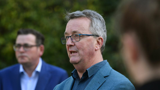 Former health and arts Martin Foley, centre, and Premier Daniel Andrews.