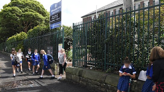 Students leaving Willoughby Girls High on Monday morning after a case of coronavirus was identified in the school.