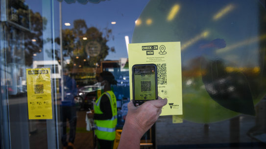 People scanning QR codes at Woolworths Preston in June.

Supermarket QR codes