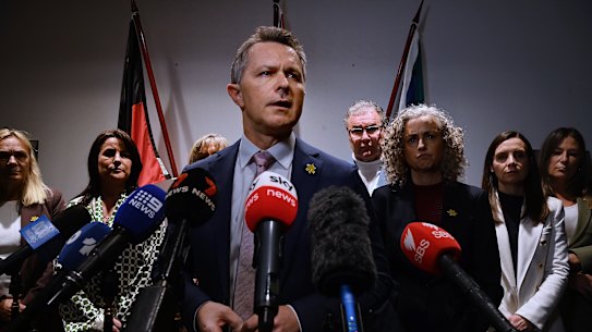 Jason Clare alongside state education ministers during a press conference on Friday.