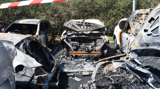 Firefighters were called to Sydney Airport where flames had engulfed five cars.