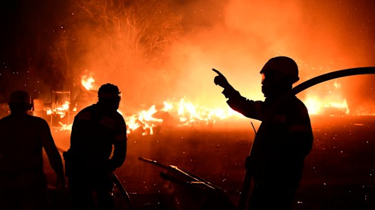 Fire burns a house in Adames area, in northern Athens, Greece, Tuesday, August 3, 2021