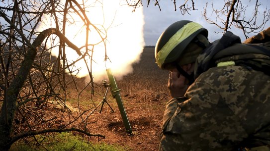 Soldiers with the Ukrainian army’s 68th Brigade fire a mortar at Russian positions in Ukraine’s eastern Donetsk region.