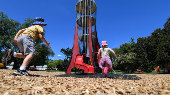 Magnet for kids: Henry and Eloise Gannon play on the rocket tower in Central Gardens, Hawthorn.