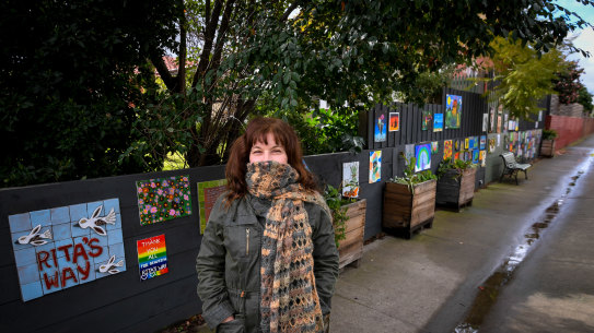 Artist Rita Santucci with some of the community arts at a laneway in Elsternwick named Rita's Way by locals.