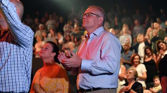 Prime Minister Scott Morrison and wife Jenny sing during an Easter Sunday service at his Horizon Church in Sydney during the 2019 election campaign.