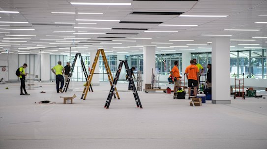 Workers at the mass-vaccination centre at Sydney Olympic Park on Thursday.
