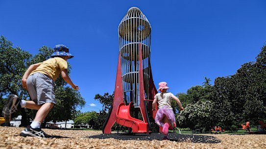 Magnet for kids: Henry and Zoe Gannon flock to the rocket play tower in Central Gardens, Hawthorn.