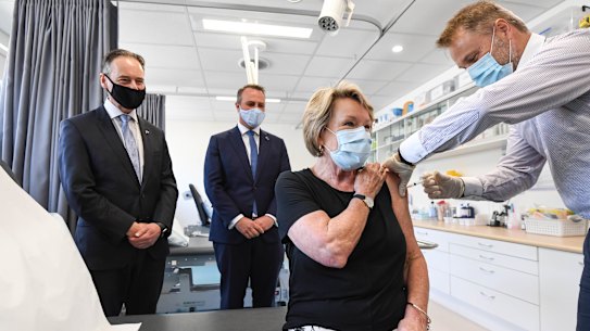 On hand for vaccinations: Health Minister Greg Hunt, Liberal MP Tim Wilson, patient Dale Austin and Dr Nick Kokotis in Melbourne on Monday. 