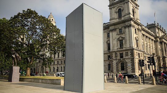 A protective barrier around the statue of Winston Churchill on Parliament Square. 