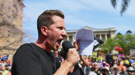 Federal Greens MP Max Chandler-Mather speaks at Brisbane’s CFMEU rally on Tuesday.