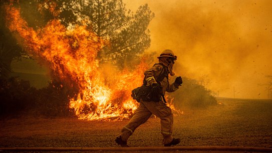 'The new abnormal': California fires rage as dry winds menace