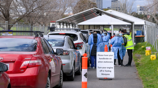 People queue in their cars at the Albert Park COVID-19 testing clinic on Friday.