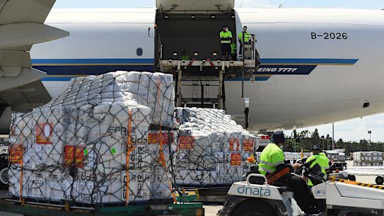Infant formula and milk powder is loaded along with other items onto a China Southern plane bound for Wuhan in China.