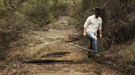 Duncan Rayner, a UNSW researcher, at a dried-up creek within the Metropolitan Special Area over the Dendrobium coal mine.