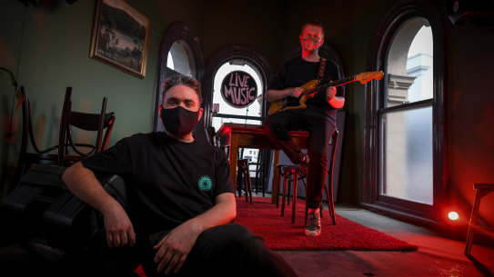 John Orris (left), owner of the Pinnacle hotel, and musician Daniel Oke.